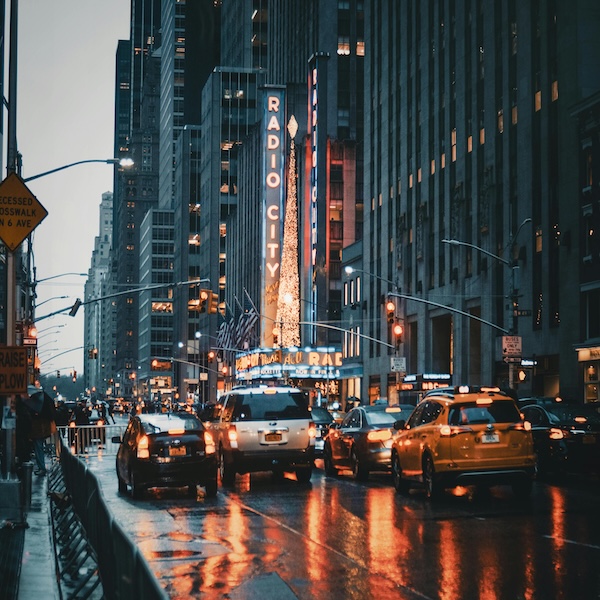 NY traffic at night time with many cars.